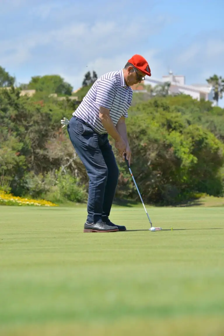 a man playing golf on a golf course